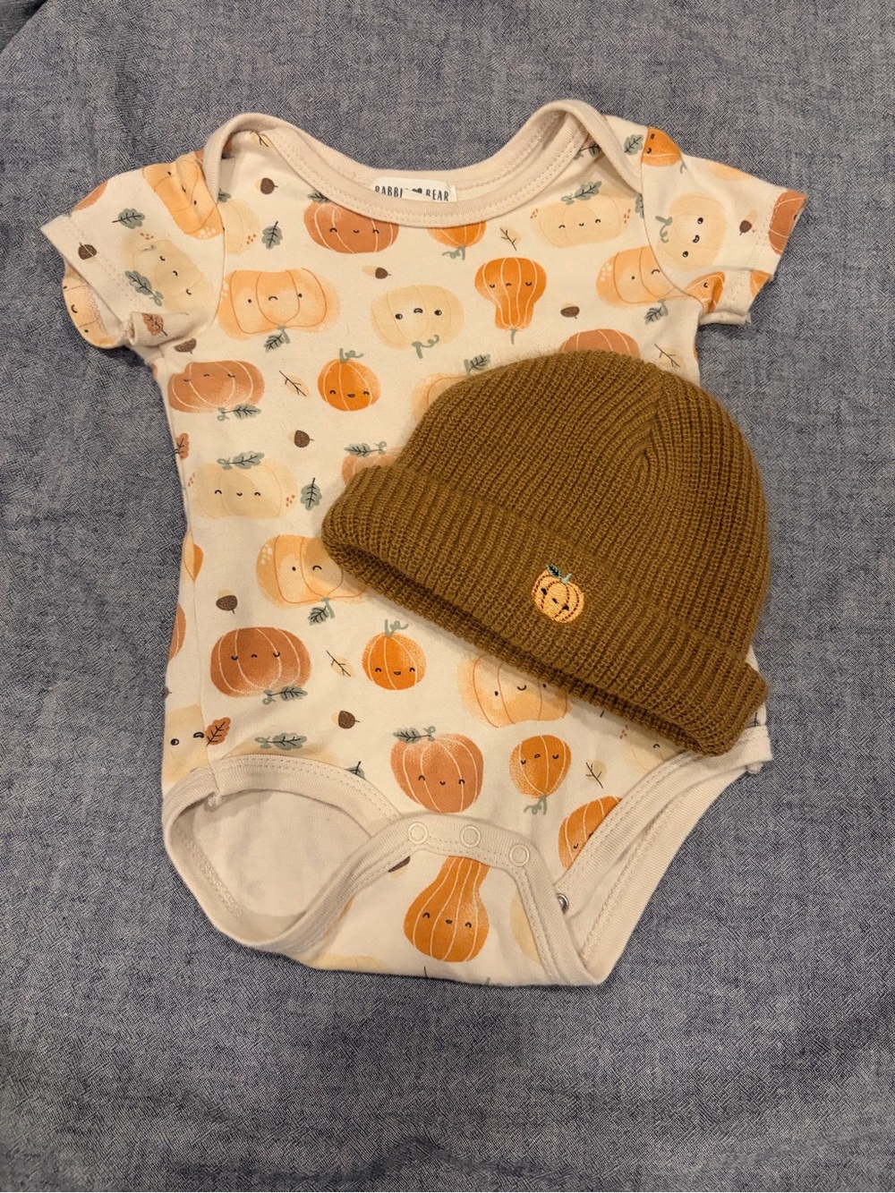 Rabbit + Bear Cream Onesie with pumpkin print + matching beanie